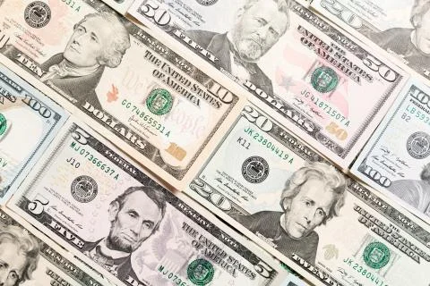 Close up of different dollar bills as a background. Amarican dollars pattern. Stock Photos