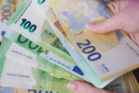 Close up of different Euro banknotes in the hands of a woman Stock Photos