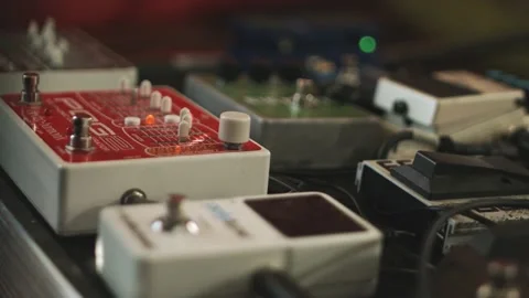 Close up of different guitar pedal effect stomp boxes on the floor in a Stock-Footage 146810145