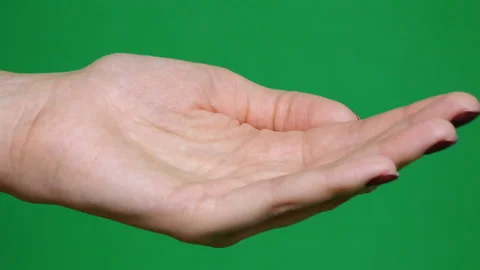 Close-up. Different kinds pills falling on green background in hand. Multi Stock-Footage 126862826