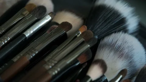 Close-up of different make-up brushes. Make-up artist tools. Stock Footage 199839626