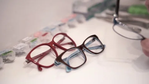 Close up  of different models of glasses on the table Vidéo 70678115