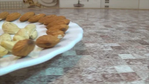 Close-up of different nuts on a plate Stock Footage 115500621