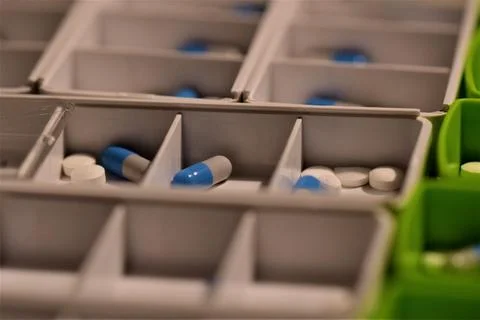 Close up of different pills prepared in tablets boxes Stock Photos