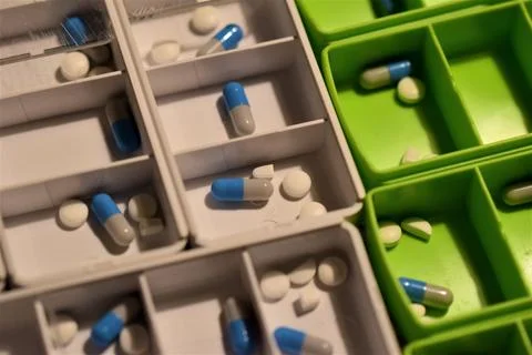 Close up of different pills prepared in tablets boxes Stock Photos