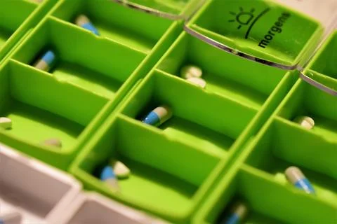 Close up of different pills prepared in tablets boxes Stock Photos