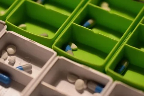 Close up of different pills prepared in tablets boxes Stock Photos