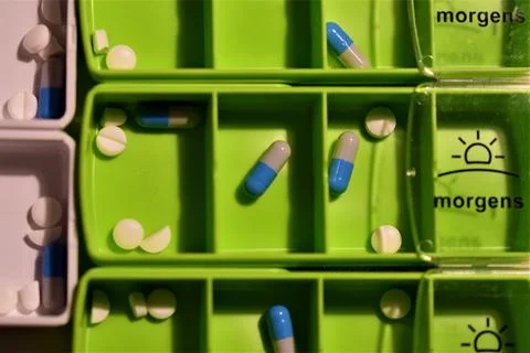 Close up of different pills prepared in tablets boxes Stock Photos