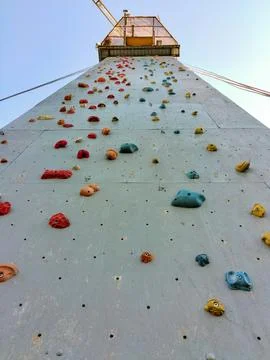Close-up of different shaped and colored hooks on a wall for sport climbing Stock Photos
