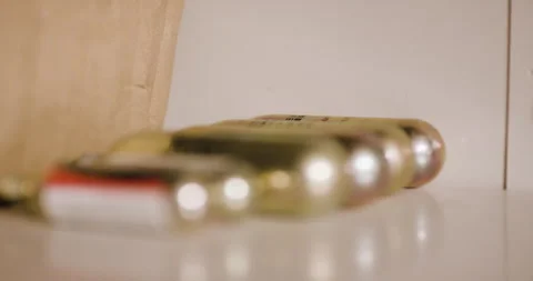 Close up of different sizes of CO2 cartridges laying on table Stock Footage 163238509