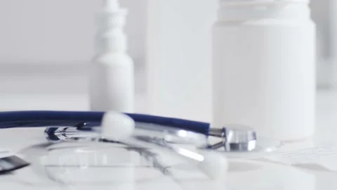 Close-up of different stuff and equipment on doctor's table in medical office in Stock Footage 140908992