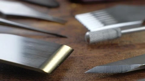 Close up of different tanner tools lying on wooden table. Stock Footage 149937012
