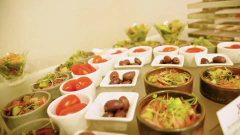 Close-up of different types of appetizers in small bowls on a buffet table. Stock-Footage 300434239