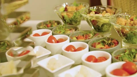 Close-up of different types of appetizers in small bowls on a buffet table. Stock-Footage 300434245
