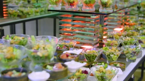 Close-up of different types of salads in small bowls on a buffet table. Stock Footage 300347446