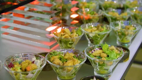 Close-up of different types of salads in small bowls on a buffet table. Stock-Footage 300347467