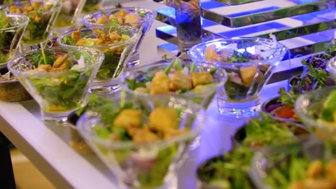 Close-up of different types of salads in small bowls on a buffet table. Stock-Footage 300347550