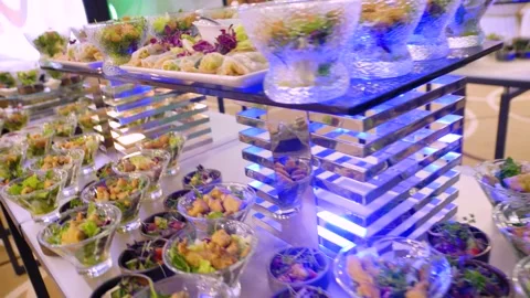 Close-up of different types of salads in small bowls on a buffet table. Stock-Footage 300347553