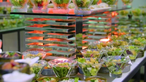 Close-up of different types of salads in small bowls on a buffet table. Stock-Footage 300347757