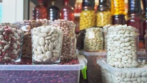 Close up of different varieties of different seeds, beans and nuts on local food Stock Footage 108196434