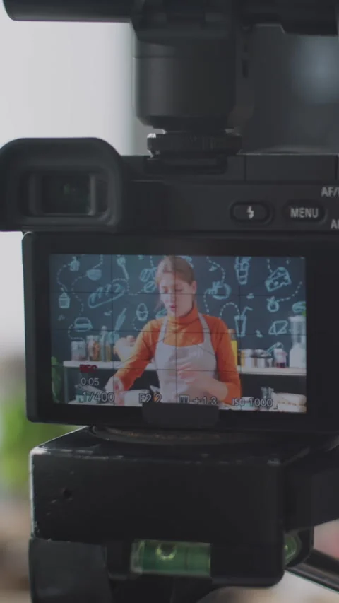 Close-Up of Digital Camera Showing Female Blogger Recording Cooking Tutorial 動画素材 300664533