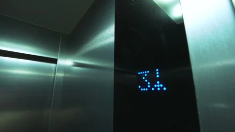 Close-up digital display in the elevator shows the rise to the 4th floor Stock Footage 197663376