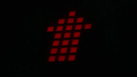 Close up of digital display showing red matrix pattern with countdown and upward Stock Footage 341012038