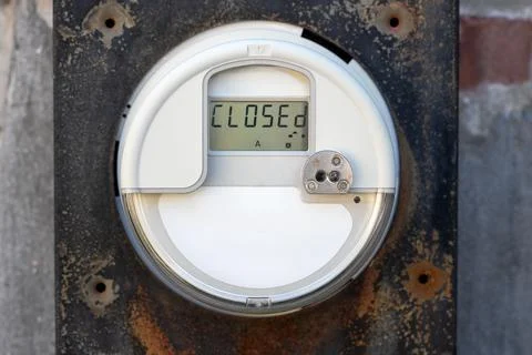 The close-up of the digital electric meter on the old metal cabinet. Stock Photos
