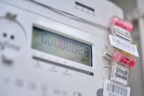 Close up of digital electricity meter display in utility box 스톡 사진