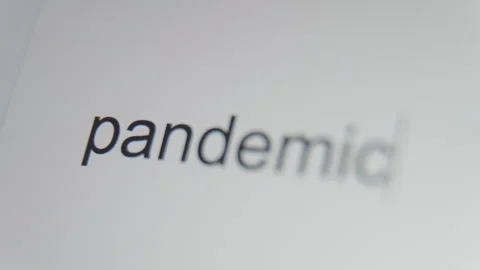 A close up of a digital screen showing a text cursor and "pandemic" being Stock Footage 273011717