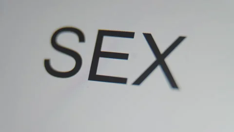 A close up of a digital screen showing a text cursor and "sex" being typed. Stock Footage 273037538