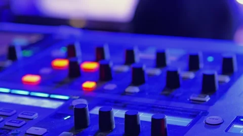 A close-up of a digital sound mixer, featuring various knobs and buttons 스톡 동영상 304723220
