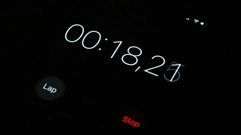 Close-up of digital stopwatch with white number and red stop key Stock Footage 223511721