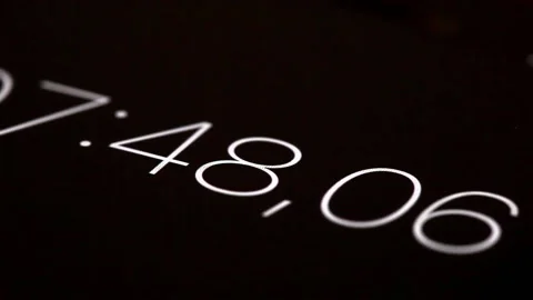 Close-up of digital stopwatch with white numbers and black background Stock Footage 223341197