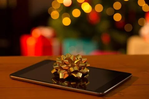 Close-up of digital table on wooden table 스톡 일러스트