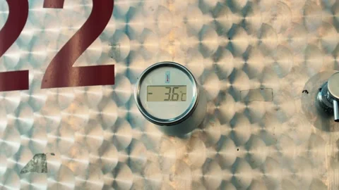 Close-up of a digital temperature gauge on brushed stainless steel surface Stock Footage 319043016