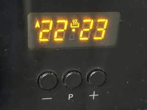 Close-Up of Digital Timer Display on Electronic Kitchen Oven Device Panel Stock Photos