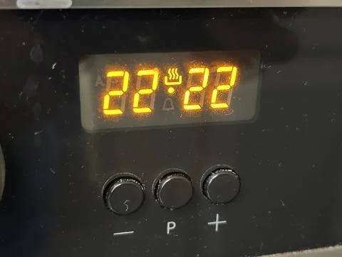 Close-Up of Digital Timer Display on Electronic Kitchen Oven Device Panel Stock Photos