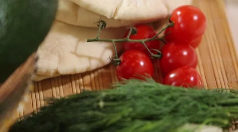 Close-up dill cherry tomatoes pita Stock Footage 67455108