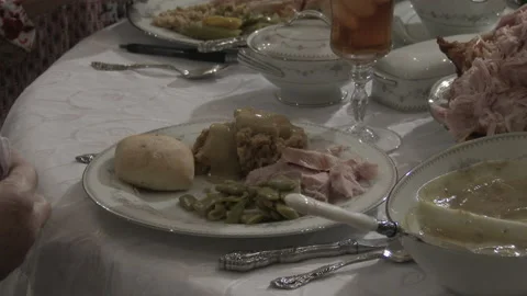 Close of diners at a dinner table with formal dinnerware, 4K. Stock Footage 145933139