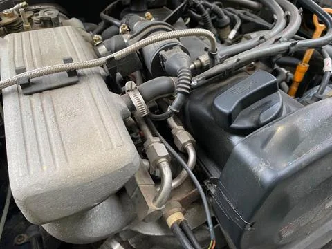 Close-up on a dirty air filter for an engine with an orange frame installed i 写真素材