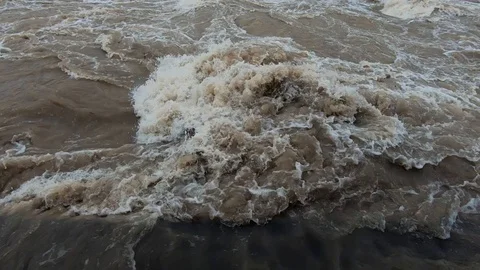 Close up dirty brown chaotic river water Stock Footage 120785779