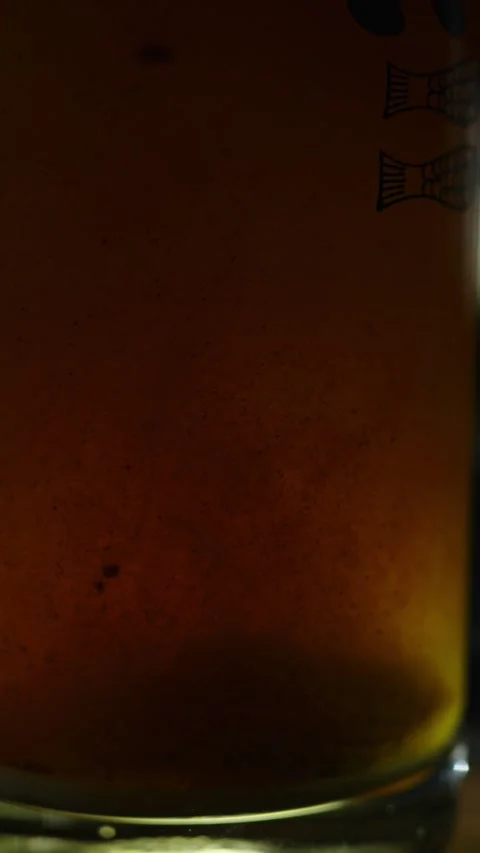 Close-up of a dirty brown liquid with heavy rust sediment and dark particles 스톡 동영상 340637186