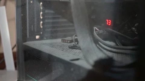 A close-up of a dirty computer case with various hardware components covered in Vidéo 337101501
