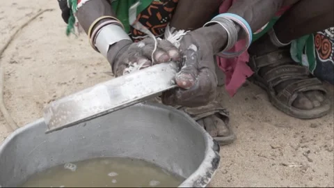 Close up of  dirty dishes being cleaned with soap and water. Stock Footage 319343220