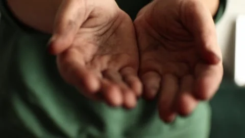 Close-up of dirty hands soiled with earth cupped in begging gesture. Powerf.. Stock Footage 324198918