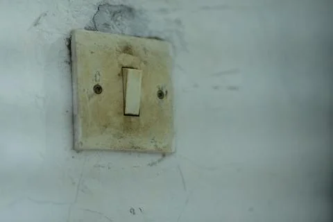 Close-up of a dirty light switch and electrical socket Stock Photos