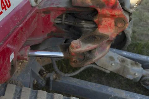 Close-up of a dirty red farm machine hitch mechanism Stock Photos