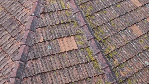A close-up of a dirty, red rooftop of a house in Porto Stock Footage 293386571