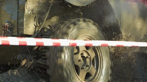 A close-up of a dirty, off-road-ready SUV splashing with water Stock Footage 344876090